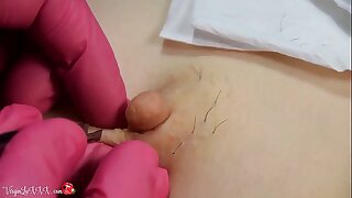 Man Beautician Plucks Hair in excess of Nipples of Girl in excess of Depilation and Massaging Tits In Red Latex Gloves